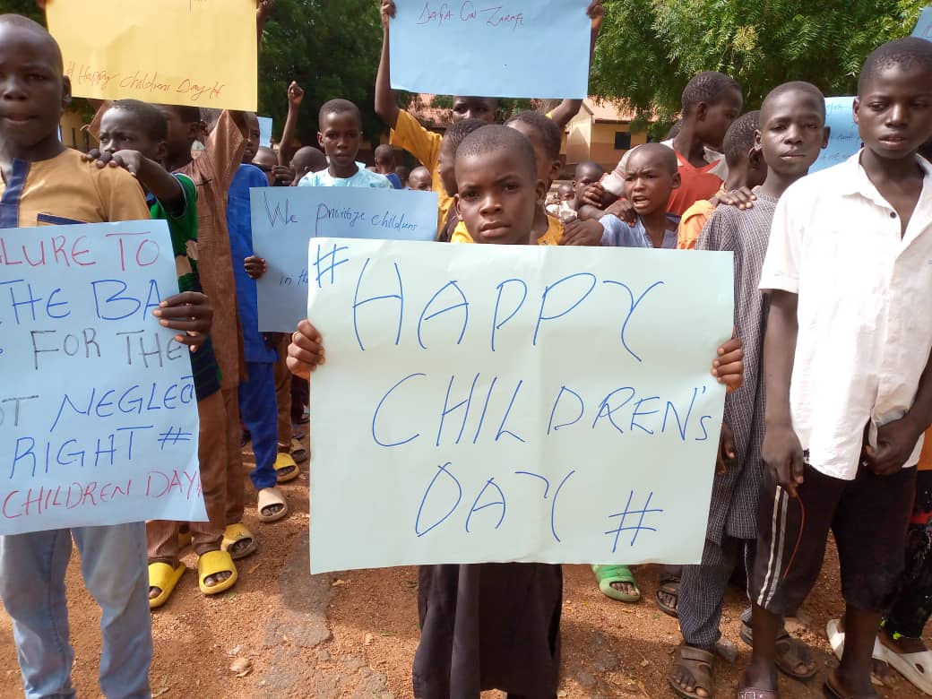 Children holding Children's Day and children's rights messages